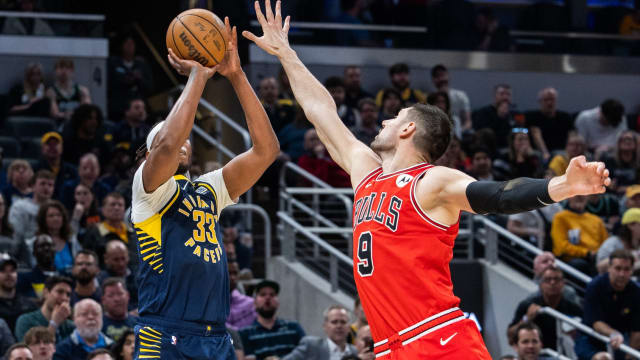 Indiana Pacers center Myles Turner (33) shoots the ball while Chicago Bulls center Nikola Vucevic (9) defends in the second half at Gainbridge Fieldhouse.